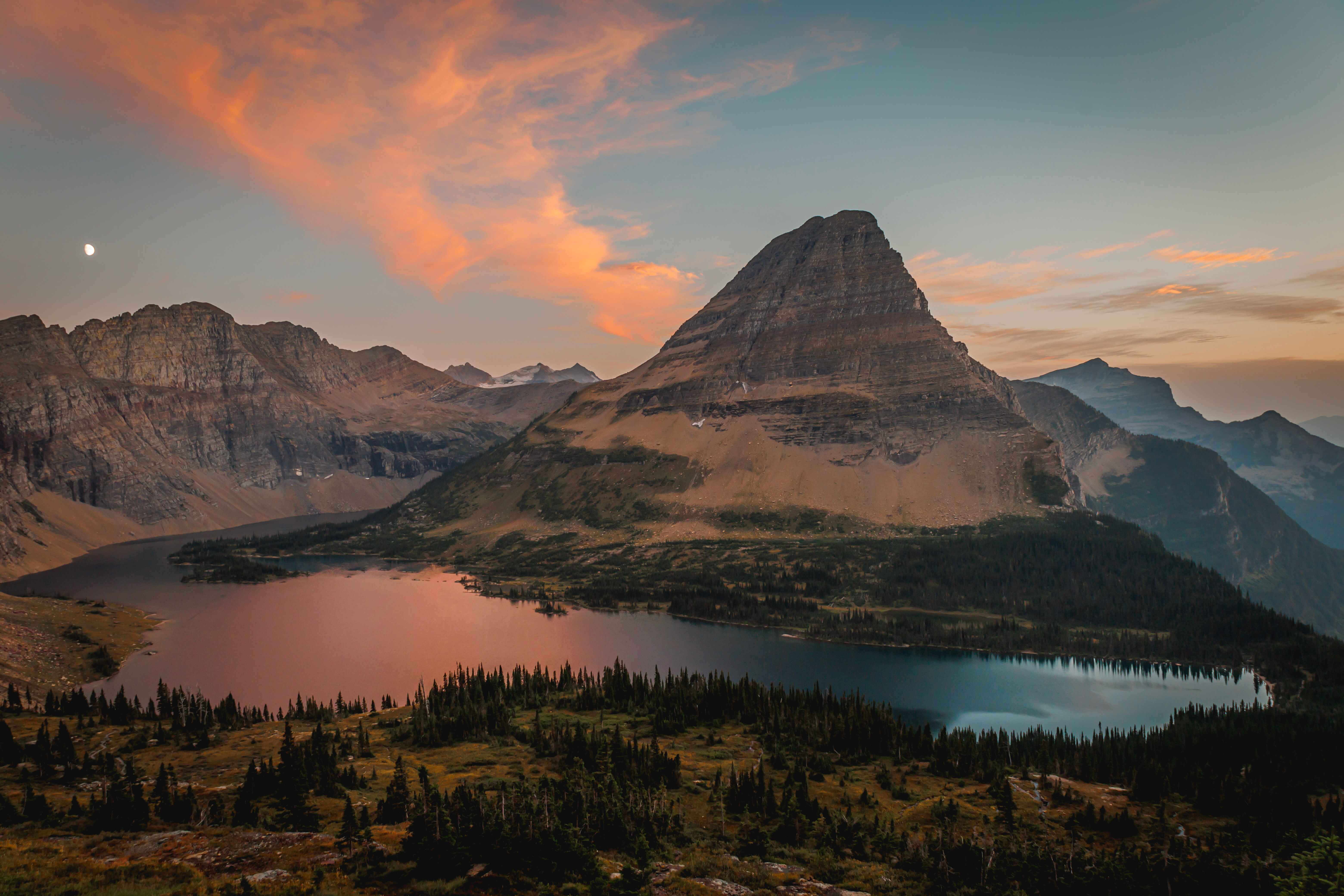 pink and blue glacial lake at sunset